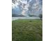 The expansive backyard is enclosed by a white privacy fence, and features a verdant lawn at 12372 Stone Bark Trl, Orlando, FL 32824
