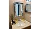 Bathroom vanity with decorative mirror, modern faucet, and stylish accents at 13 W Marbrisa Way, Kissimmee, FL 34743