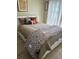 Comfortable bedroom with a queen-sized bed with a stylish decorative blanket at 13 W Marbrisa Way, Kissimmee, FL 34743
