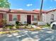 Charming single story house with painted facade, decorative shutters, and tidy landscaping at 13 W Marbrisa Way, Kissimmee, FL 34743