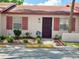 Charming single story house with painted facade, decorative shutters, and tidy landscaping at 13 W Marbrisa Way, Kissimmee, FL 34743