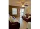 Inviting living area featuring wood-look floors, neutral paint, and comfortable leather seating at 13 W Marbrisa Way, Kissimmee, FL 34743