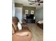 Inviting living room with modern ceiling fan, and comfortable leather seating at 13 W Marbrisa Way, Kissimmee, FL 34743