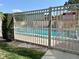 Gated community pool with notice sign about pool rules and regulations at 13 W Marbrisa Way, Kissimmee, FL 34743