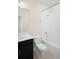 Bright bathroom features a sleek vanity and a shower-tub combination with white tiling at 1312 Royal St George Blvd, Davenport, FL 33896