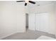 Bedroom with a closet and connecting hallway door, neutral walls, and plush carpeting at 1312 Royal St George Blvd, Davenport, FL 33896