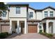 Beautiful two-story townhome featuring a private garage and covered entryway at 1312 Royal St George Blvd, Davenport, FL 33896
