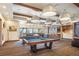 Bright game room featuring two pool tables, seating and kitchen area for residents' entertainment at 1312 Royal St George Blvd, Davenport, FL 33896
