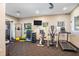 Well-equipped fitness center with various exercise machines and weights at 1312 Royal St George Blvd, Davenport, FL 33896