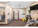 Gym featuring universal weight machine, free weights, TV and Mirror at 1312 Royal St George Blvd, Davenport, FL 33896