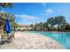Resort-style community pool area with lounge chairs and lush landscaping at 1312 Royal St George Blvd, Davenport, FL 33896
