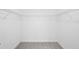 Walk-in closet with built-in shelving and neutral carpeting at 1312 Royal St George Blvd, Davenport, FL 33896