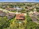 Stunning aerial view showcasing the home's backyard pool, patio and lush, landscaped community, perfect for relaxing at 13130 Meergate Cir, Orlando, FL 32837