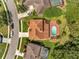 Aerial view of a beautiful home with a pool and brick patio at 13130 Meergate Cir, Orlando, FL 32837