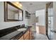 Bathroom features a sleek vanity with granite countertops and walk-in shower, creating a spa-like experience at 13130 Meergate Cir, Orlando, FL 32837