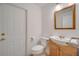Powder room with wood vanity and lighting at 13130 Meergate Cir, Orlando, FL 32837