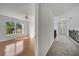 Bright bedroom featuring hardwood floors, a ceiling fan, and a large window with outside view at 13130 Meergate Cir, Orlando, FL 32837