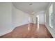 Spacious bedroom features wood flooring, neutral walls, and a ceiling fan at 13130 Meergate Cir, Orlando, FL 32837
