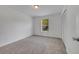 Bedroom featuring light-colored carpet, natural light from the window, and a closet at 13130 Meergate Cir, Orlando, FL 32837