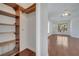 Walk-in closet with built-in shelving and rods, connected to a spacious bedroom at 13130 Meergate Cir, Orlando, FL 32837