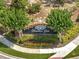 An inviting brick community sign with the name 'Heather Glen' surrounded by lush landscaping and colorful flowers at 13130 Meergate Cir, Orlando, FL 32837