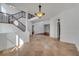 Grand entrance boasts tile floors, staircase with iron railing, and recessed lighting for a welcoming ambiance at 13130 Meergate Cir, Orlando, FL 32837