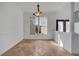 Entry area with travertine flooring, window with shade, and view of the front yard landscape at 13130 Meergate Cir, Orlando, FL 32837