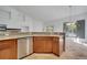 Kitchen with stainless steel appliances and granite countertops overlooking the pool at 13130 Meergate Cir, Orlando, FL 32837
