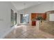 Open kitchen with wood cabinets and access to the backyard at 13130 Meergate Cir, Orlando, FL 32837