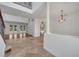 Open-concept living area featuring tiled floors, staircase, and plenty of natural light with access to the backyard at 13130 Meergate Cir, Orlando, FL 32837