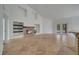 Bright living room with fireplace, built-in shelving, and access to the pool area at 13130 Meergate Cir, Orlando, FL 32837