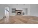 Spacious living room featuring a stone fireplace and shelving with an open floor plan at 13130 Meergate Cir, Orlando, FL 32837