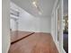 Open living room with wood floors, recessed lighting, and staircase access at 13130 Meergate Cir, Orlando, FL 32837