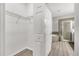 Bathroom view including walk-in closet with wire shelving, and large glass shower and tub at 1628 Portofino Meadows Blvd, Orlando, FL 32824