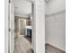 Bathroom view including walk-in closet with wire shelving, and large glass shower with a blue sink vanity at 1628 Portofino Meadows Blvd, Orlando, FL 32824