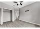 Spacious bedroom with modern flooring, a ceiling fan, closet and neutral walls at 1628 Portofino Meadows Blvd, Orlando, FL 32824