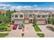 Well-maintained townhome exterior with brick driveway, two car garage, and manicured landscaping at 1628 Portofino Meadows Blvd, Orlando, FL 32824