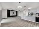 Well-lit living room and kitchen area with modern finishes at 1628 Portofino Meadows Blvd, Orlando, FL 32824