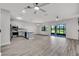Bright open floor plan combines the living area and modern kitchen with stainless steel appliances at 1628 Portofino Meadows Blvd, Orlando, FL 32824