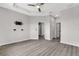 Spacious main bedroom features a ceiling fan, gray walls, gray flooring, and ensuite bathroom and walk-in closets at 1628 Portofino Meadows Blvd, Orlando, FL 32824