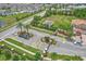 Street view showcases a community entrance with well-manicured landscaping, palm trees, and secure gate access at 1628 Portofino Meadows Blvd, Orlando, FL 32824