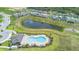 Aerial view of the community pool and surrounding homes in the Tarpon Bay community at 172 Roseville Dr, Haines City, FL 33844