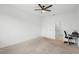 Empty bedroom with neutral walls and carpet, complemented by a ceiling fan and multiple doorways at 172 Roseville Dr, Haines City, FL 33844