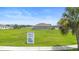 Exterior shot of a home in the Tarpon Bay community and large open grassy area at 172 Roseville Dr, Haines City, FL 33844