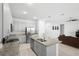Spacious open-concept kitchen with stainless steel appliances, granite counters, and central island at 172 Roseville Dr, Haines City, FL 33844