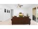 Bright living room featuring a ceiling fan, comfy couch, and sliding glass doors at 172 Roseville Dr, Haines City, FL 33844