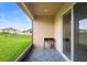 View of the patio featuring a grill and views of the fenced in yard at 172 Roseville Dr, Haines City, FL 33844