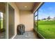 Screened patio with brick floors featuring a grill with a cover for protection at 172 Roseville Dr, Haines City, FL 33844