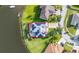 Enjoy lakefront living in this home with a private, screened-in pool and energy-efficient solar panels at 1760 Boat Launch Rd, Kissimmee, FL 34746