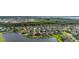 An aerial perspective of luxurious lakeside homes featuring private docks and landscaped yards at 1760 Boat Launch Rd, Kissimmee, FL 34746
